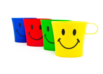 Colour cups with drawing in a kind of smile