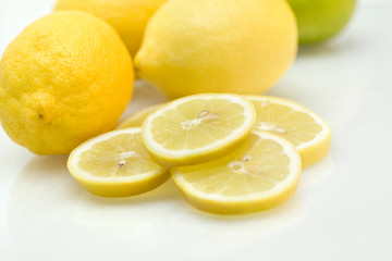 Lemons with slices of lemon and lime