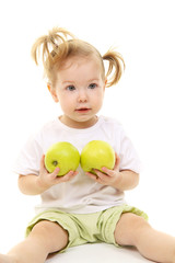 Fototapeta na wymiar Baby girl with green apples