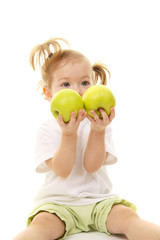 Fototapeta premium Baby girl with green apples