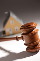 Gavel and Model Home on Gradated Background