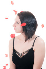 Beautiful girl with rose petals