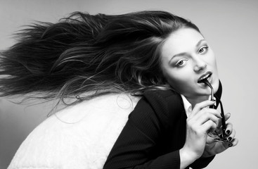 Obraz premium beautiful girl is sitting in a chair