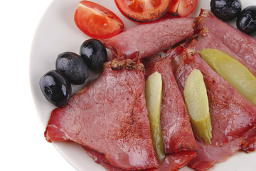 sliced served sausage with salted cucumber