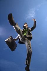 Businessman With Briefcase Jumping
