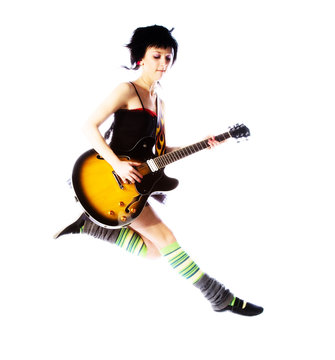 Young Girl Jumping With A Guitar