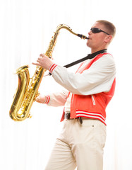 Fototapeta na wymiar A man plays the saxophone
