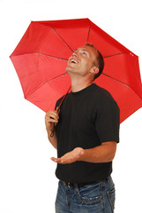 Happy man under an umbrella