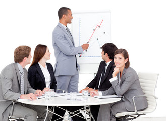 Confident businessman reporting sales figures