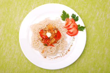 plate of spaghetti with mushrooms and tomatoes