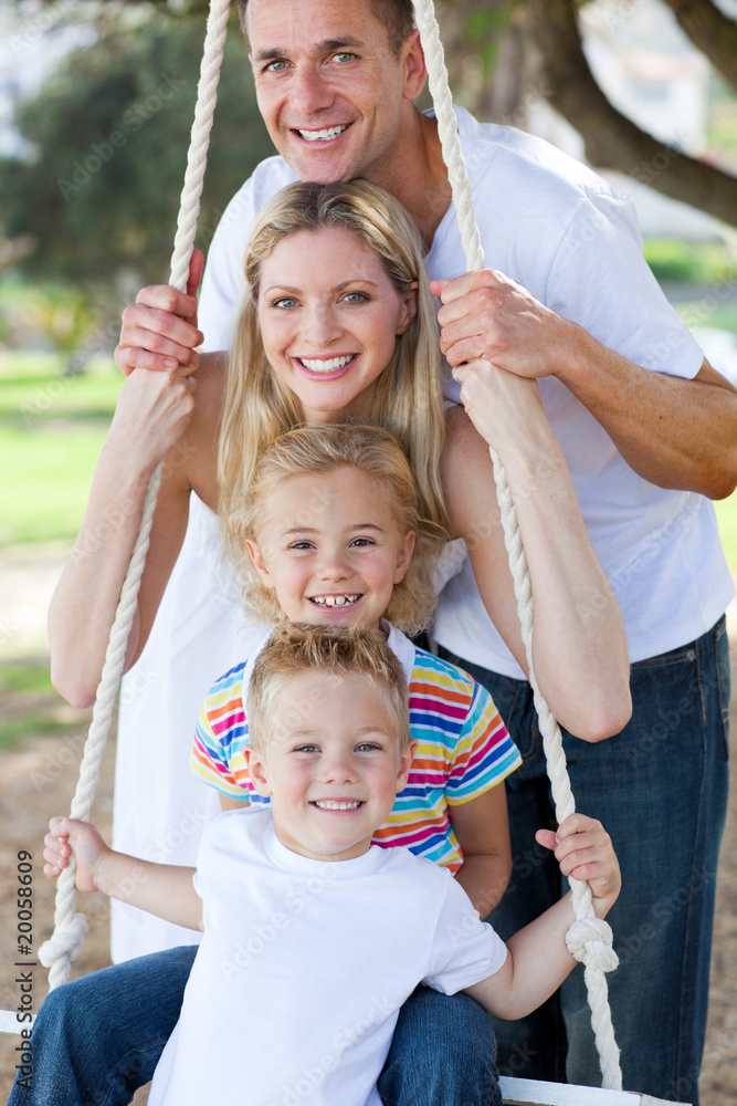 Wall mural Jolly family swinging