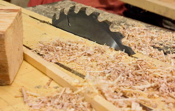Circular saws and sawdust in workshop