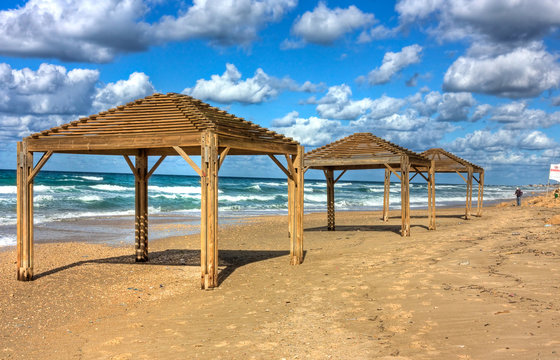 Sea shore and wooden sun shelters &ndash; Netanya, Israel