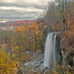 Beauiful waterfall cascade in the mountains during autumn.
