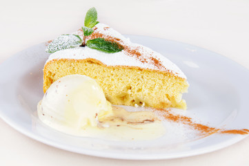 Delicate apple sponge cake with mint and vanilla ice cream