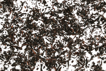 Black tea leaves background