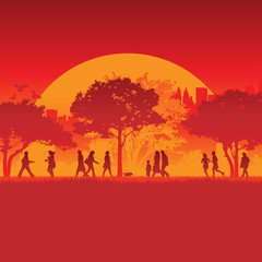 Fototapeta na wymiar Silhouetted runners in front of city background and sun