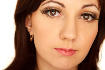 Portrait of charming girl against white wall