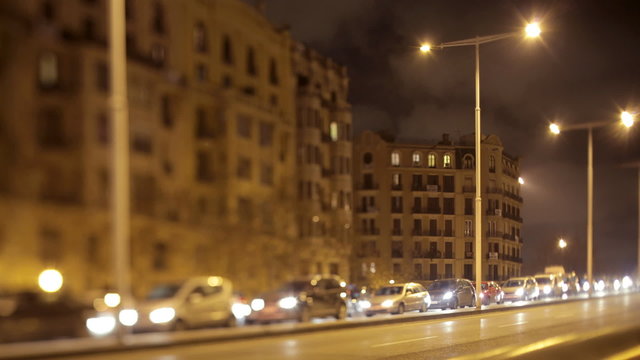 timelapse of a street scene in barcelona, spain at night
