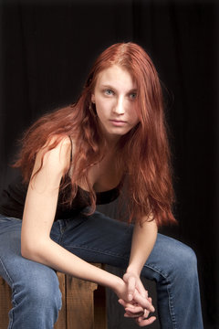 anxious teen redhead seated