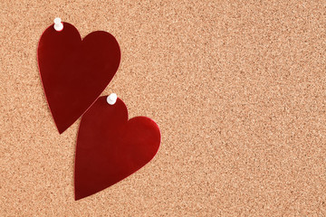 red heart on corkboard
