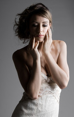Emotional Woman against Grey Background