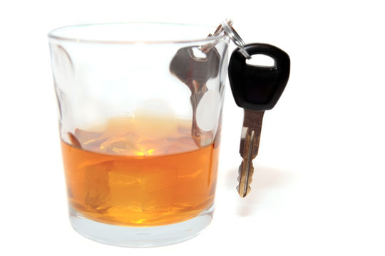car keys inside whiskey glass