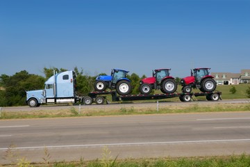 Lorry truck transport with three agriculture tractor