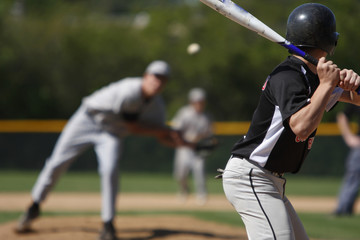 batter about to hit a pitch during a baseball game