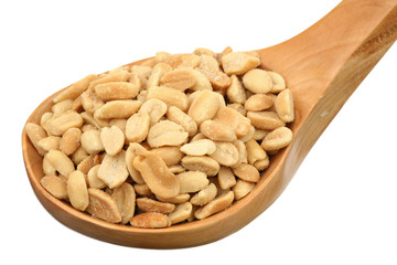Peanut in a wooden spoon on a white background