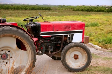Agriculture aged red tractor  retro vintage machine