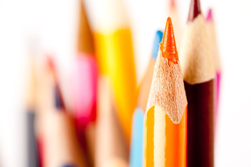 Many pencils over blurred background