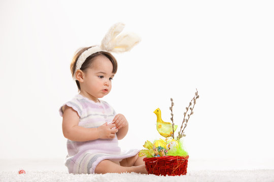 Baby girl with easter basket