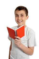 Obraz premium Smiling school student holding small book