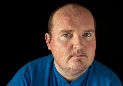 closeup portrait capture of a male on black background