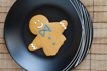 ginger bread man remains on  the plate