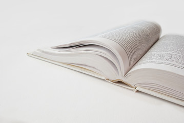 Isolated opened book
