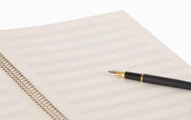 Pen on a musical notebook