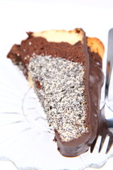 Slice of a bundt cake covered with chocolate on a plate