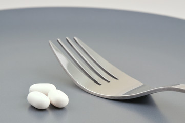 Teller mit  Pllen und Gabel