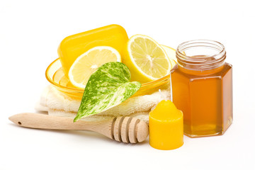 bar of glycerin soap, jar of honey and lemon