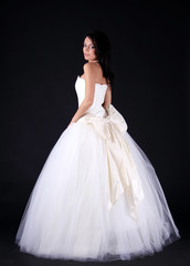 Fototapeta na wymiar Full length of a beautiful woman in wedding dress