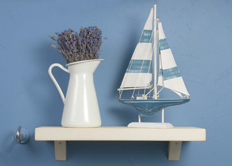Blue and white still-life with lavender and sailboat