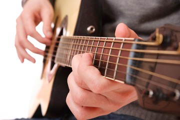 Obraz na płótnie Canvas Close up of guitarist hand playing guitar