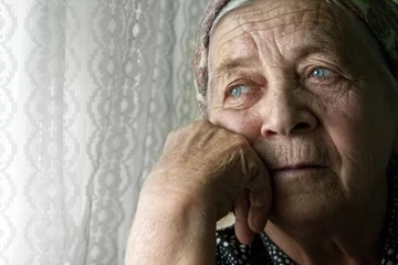 Sad lonely pensive old senior woman © dundanim