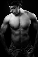 Fototapeta na wymiar Black and white muscular male torso