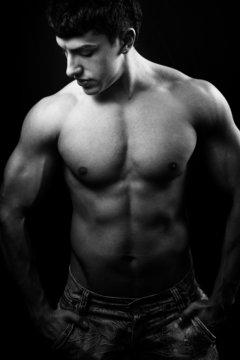 Black and white muscular male torso © dundanim