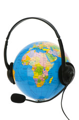 Headset on globe isolated on the white