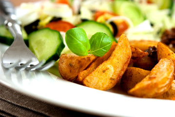Roasted potatoes with fresh vegetables
