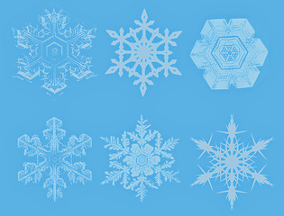 Lite Blue Snowflakes on blue background